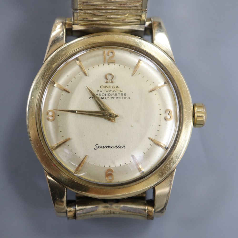 A gentlemans steel and gold plated Omega Automatic Chronometer Seamaster wrist watch, on associated bracelet,